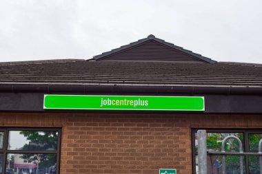 Newcastle upon Tyne, United Kingdom, 13 July 2022 - Exterior view of the Jobcentre Plus in the centre of Newcastle. People visit the employment center. Offices of Jobcentre Plus exterior.