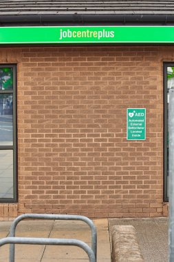 Newcastle upon Tyne, United Kingdom, 13 July 2022 - Exterior view of the Jobcentre Plus in the centre of Newcastle. People visit the employment center. Offices of Jobcentre Plus exterior.