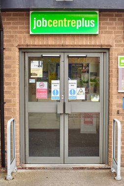 Newcastle upon Tyne, United Kingdom, 13 July 2022 - Exterior view of the Jobcentre Plus in the centre of Newcastle. People visit the employment center. Offices of Jobcentre Plus exterior.