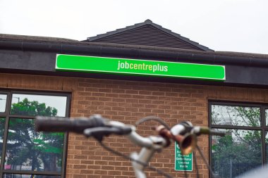 Newcastle upon Tyne, United Kingdom, 13 July 2022 - Exterior view of the Jobcentre Plus in the centre of Newcastle. People visit the employment center. Offices of Jobcentre Plus exterior.
