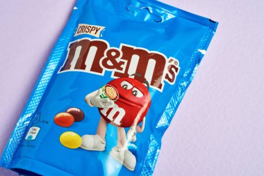 New pack of MMs on a lavender background. new MMs crispy.