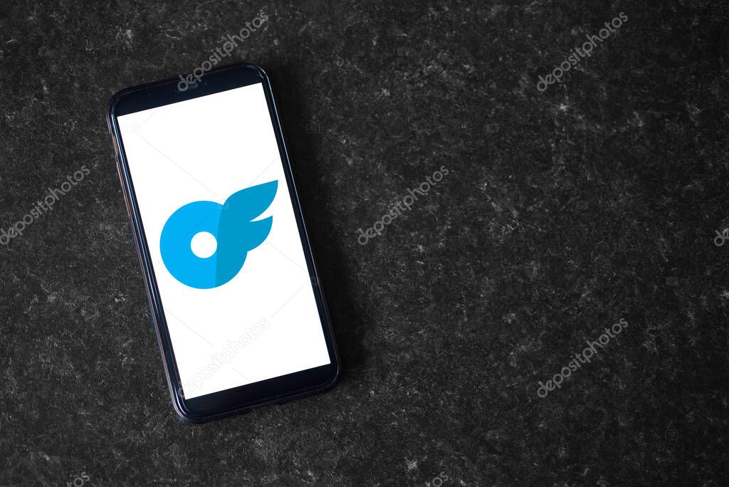 UK, Newcastle, August 21, 2022: The onlyfans logo on the screen of a modern smartphone, which lies on a surface of artificial stone
