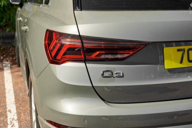 UK, Newcastle, 27 August 2022: View of the rear of the Audi Q3 2022. The trunk is gray-green. Modern optics.