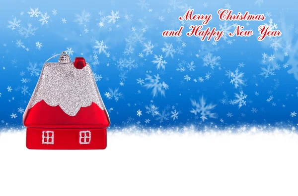 Merry Christmas and Happy New Year blue background with Christmas toy in the form of a small house — Stock Photo, Image