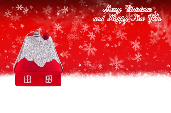 Merry Christmas and Happy New Year red background with Christmas toy in the form of a small house — Stock Photo, Image