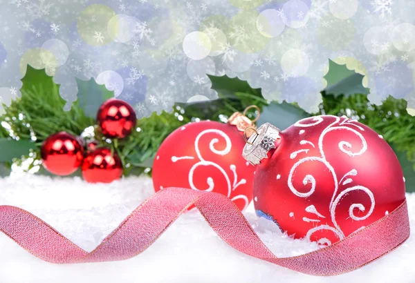 Christmas background with red balls and holly leaves and berries — Stock Photo, Image