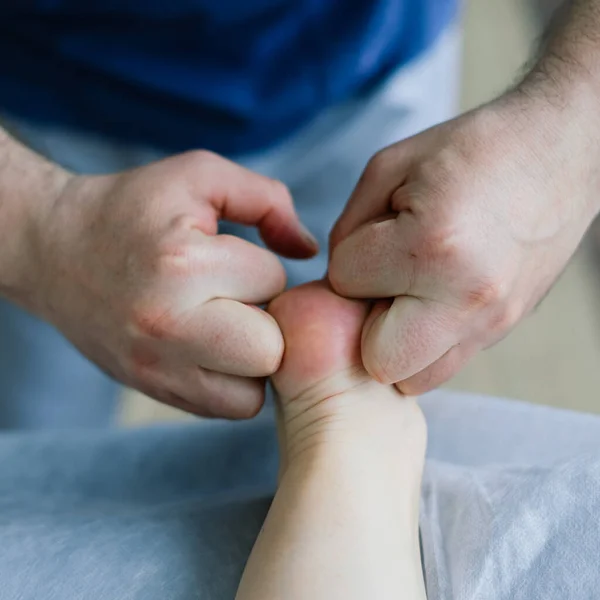 Anti-cellulite foot massage for fat woman. Concept of personal care, weight loss, diet. Close-up.