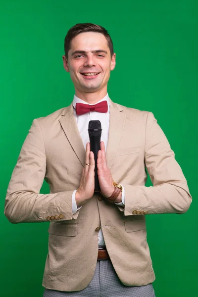 Portrait Male Announcer Holding Microphone Isolated Green White Background — Stock Photo, Image