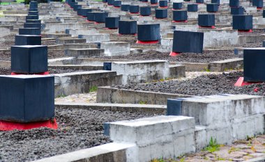 The bells in Khatyn with sky background. The cemetery of burned vilages.