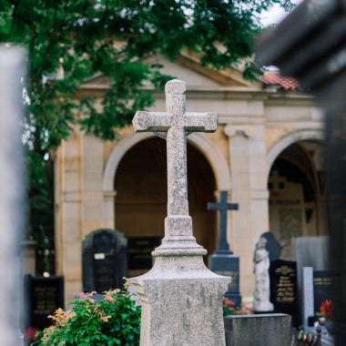 Cemetery statues, a despairing woman statue, crosses, resting place graveyard sculpture, art