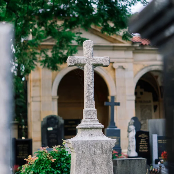Cemetery statues, a despairing woman statue, crosses, resting place graveyard sculpture, art