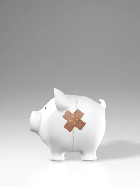 Piggy bank - crack and plaster — Stock Photo, Image