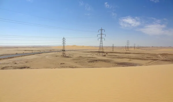 Desert with power poles — Stock Photo, Image