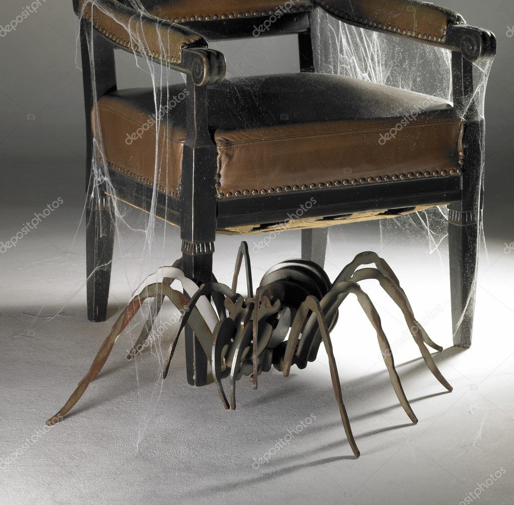 Winged chair and metallic spider — Stock Photo © prill 19782935