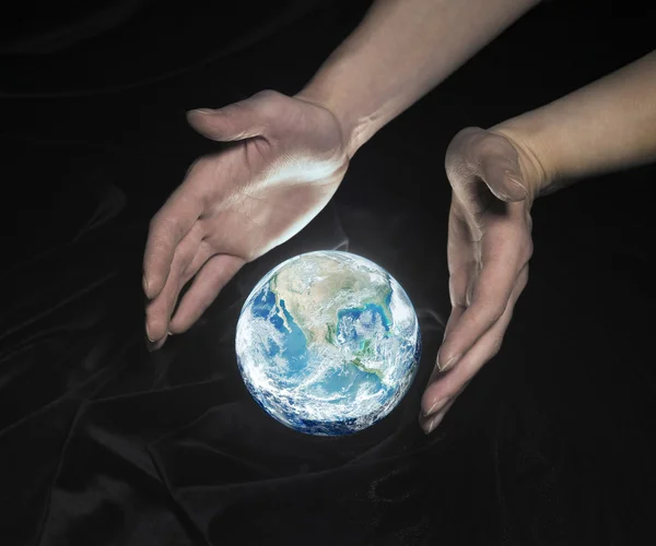 Crystal globe and hands — Stock Photo, Image
