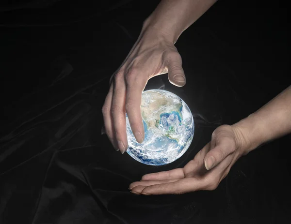 Crystal globe and hands — Stock Photo, Image