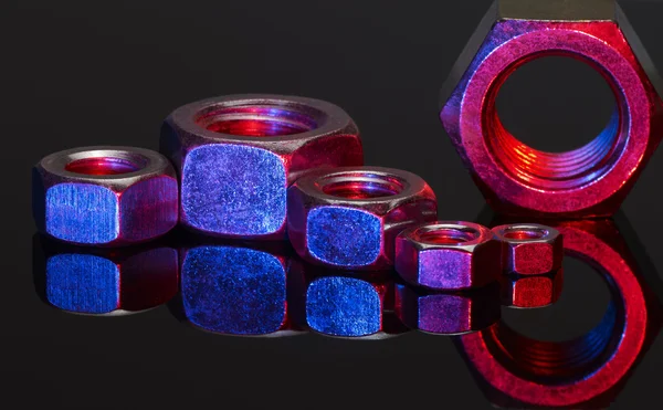 Illuminated screw nuts — Stock Photo, Image