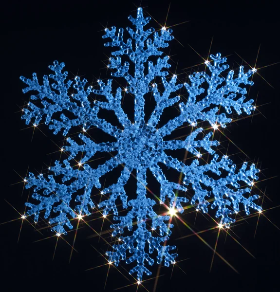 Twinkling blue snowflake — Stock Photo, Image