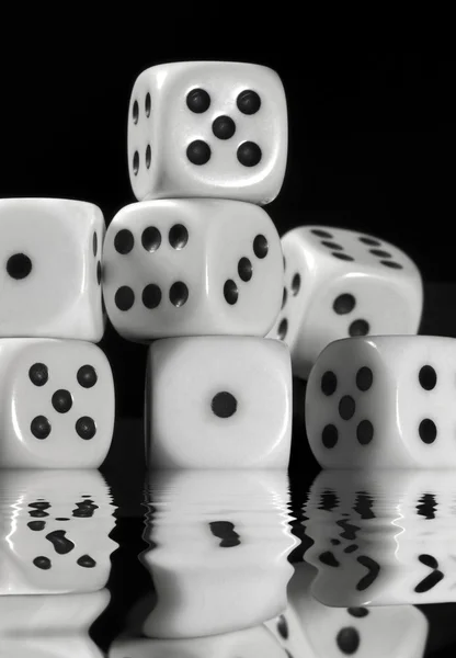 Sinking pile of white dice — Stock Photo, Image