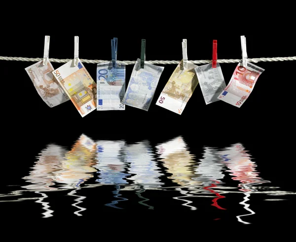 Clothesline and money — Stock Photo, Image