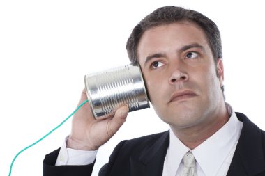 işadamı ve teneke kutu telefon