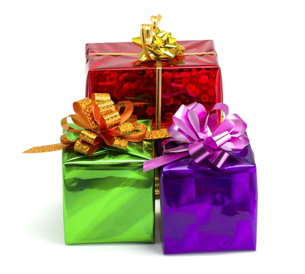 Fialové, zelené, červené a žluté dárek — Stock fotografie
