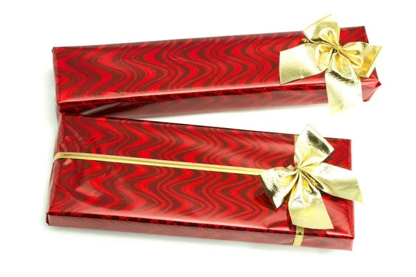 Červené dárky s zlata luky — Stock fotografie
