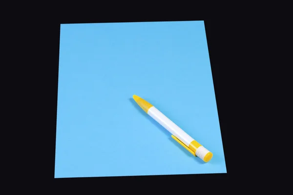 Caneta sobre papel azul — Fotografia de Stock