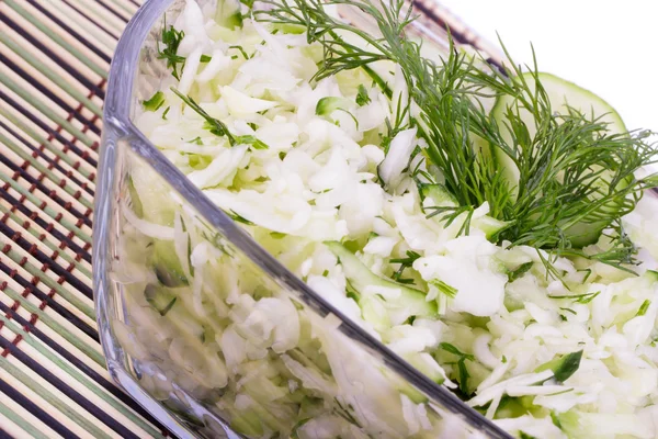 Salad from cabbage with a cucumber and greens — Stock Photo, Image