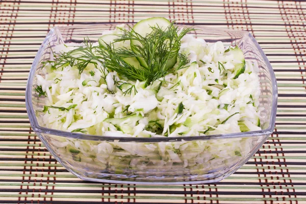 Salad from cabbage with a cucumber and greens — Stock Photo, Image