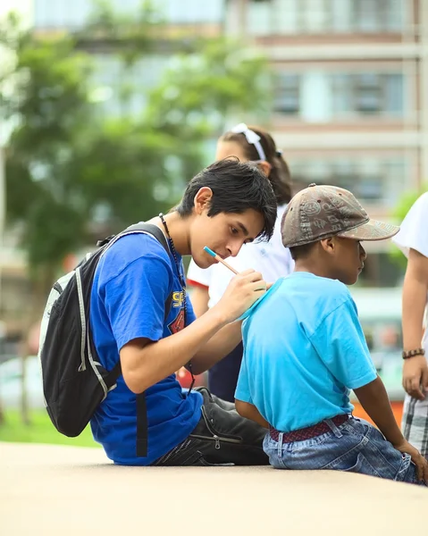 Writing on the Shoulders of Another — Stock Photo, Image