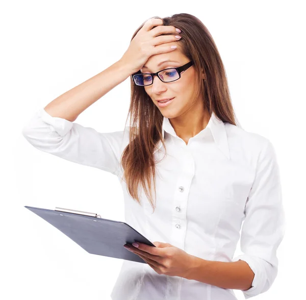 Lovely confused businesswoman with clipboard — Stock Photo, Image