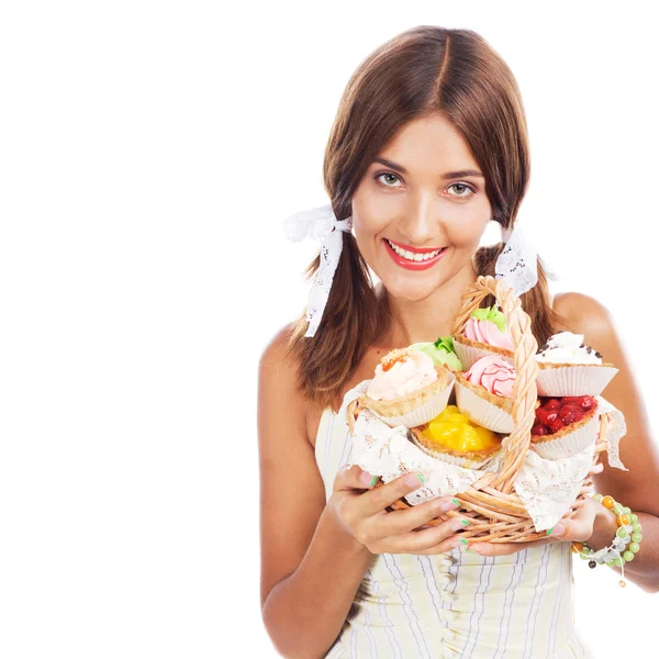 Lovely woman with a basket of cakes — Stock Photo, Image