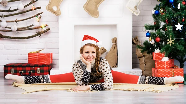 Girl doing yoga on Christmas — Stock Photo, Image