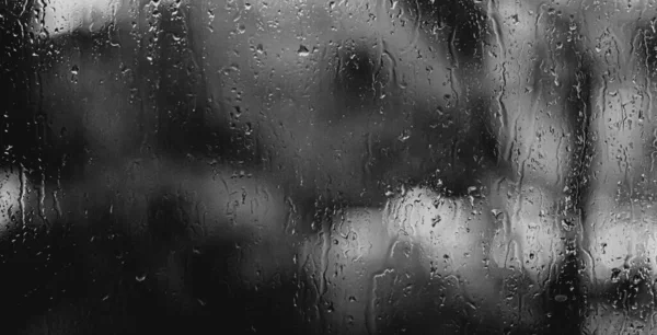 Blurry Rainy Background Écoulement Eau Tombe Sur Verre Fenêtre Image En Vente