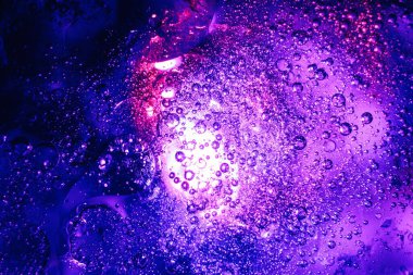 Güzel, soyut, sürrealist ışık, pastel, kara büyü damlaları. Tasarım için arkaplan modeli. Makro fotoğrafçılık görünümü.