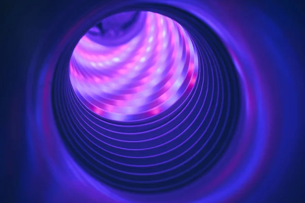 Abstract swirl tunnel with violet light on a background pattern textured for design.