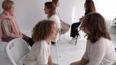 Women of different ages participate in a therapeutic psychological group. Meeting of women of different generations, diversity concept