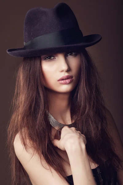 Woman with open lips in black hat on dark background — Stock Photo, Image