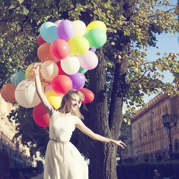 Femme avec des ballons colorés Images De Stock Libres De Droits