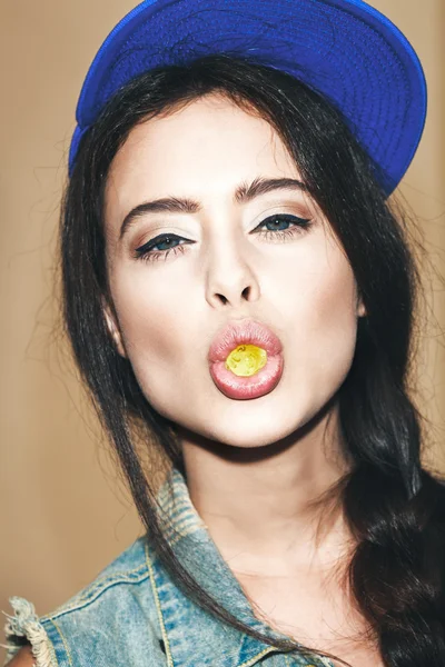 Young sexy woman biting gelatin candy — Stock Photo, Image