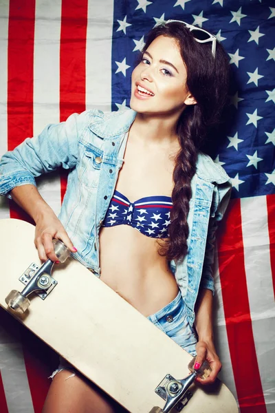 Woman in sunglasses with national usa flag — Stock Photo, Image
