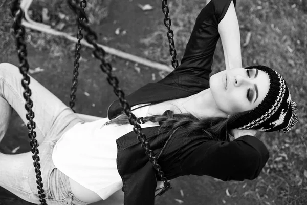 Gentle portrait of a beautiful girl on a swing — Stock Photo, Image