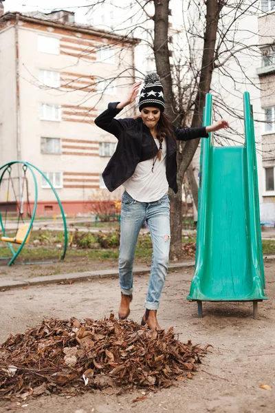 Gentle portrait of a beautiful girl on a swing — Stock Photo, Image