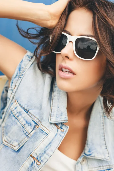 Young brunette woman in sunglasses Stock Image