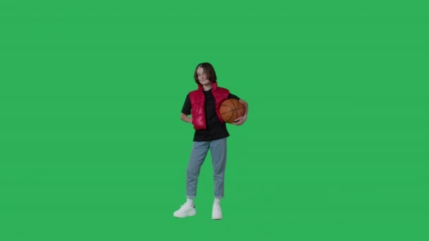 Young female holding basketball ball — Wideo stockowe