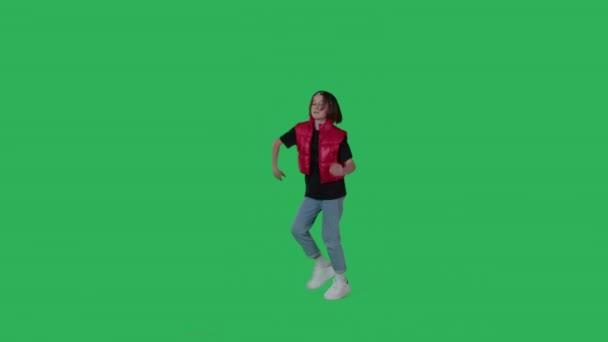 Young beautiful girl dancing over green screen — 图库视频影像