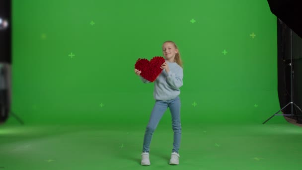 Girl with hand-made paper heart in her hands — Wideo stockowe