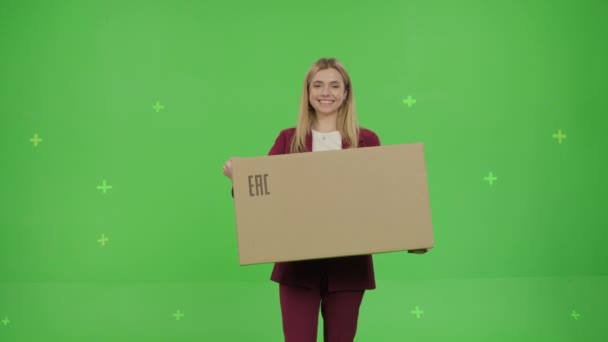 Woman holds a large paper box with goods — 비디오