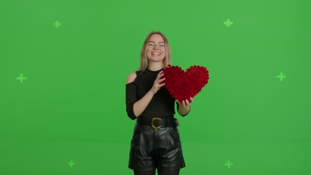 Girl with hand-made paper heart in her hands – stockvideo